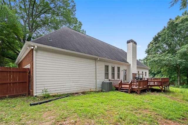 1732 Winding Woods Ln, Jonesboro, GA 30236 - back of house with a wooden deck, a chimney, and roof with shingles