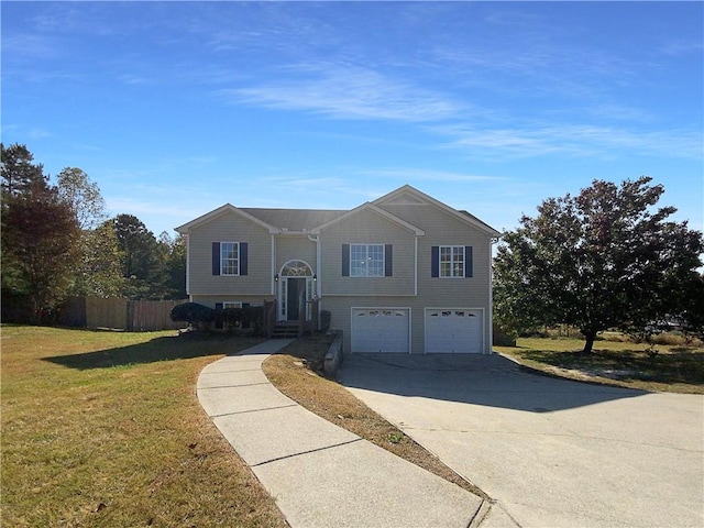 split foyer home with a front lawn and a garage