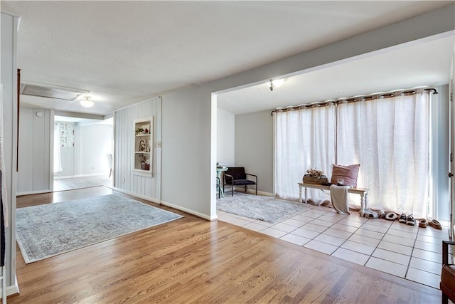 foyer entrance with light wood-type flooring