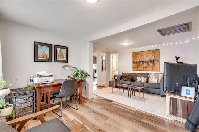 home office with light wood-type flooring