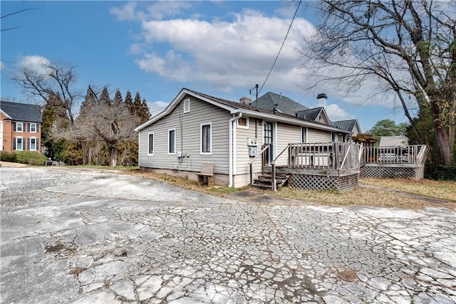 rear view of house with a deck