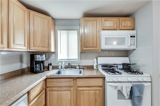 kitchen featuring tasteful backsplash, white appliances, light brown cabinetry, and sink