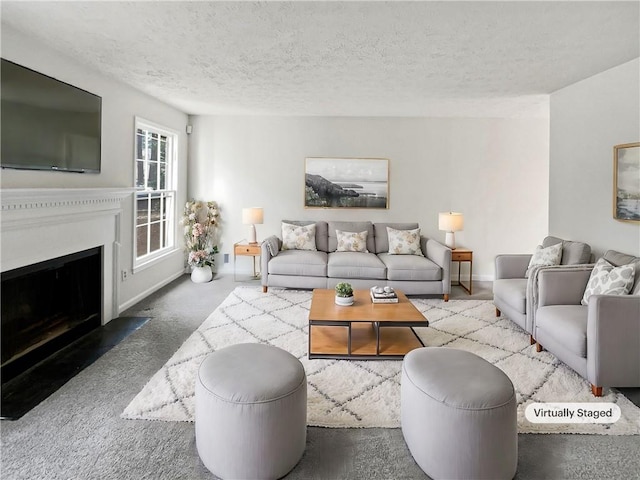 carpeted living room featuring a textured ceiling