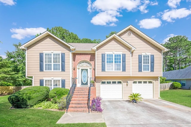 435 Flowering Trl, Grayson, GA 30017 - bi-level home with concrete driveway and an attached garage