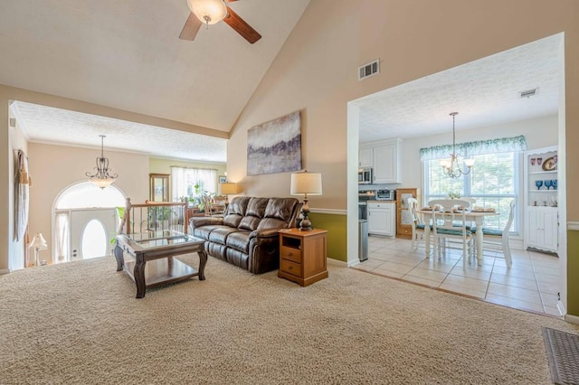 435 Flowering Trl, Grayson, GA 30017 - living room featuring a chandelier, light carpet, ceiling fan, baseboards, and healthy amount of natural light