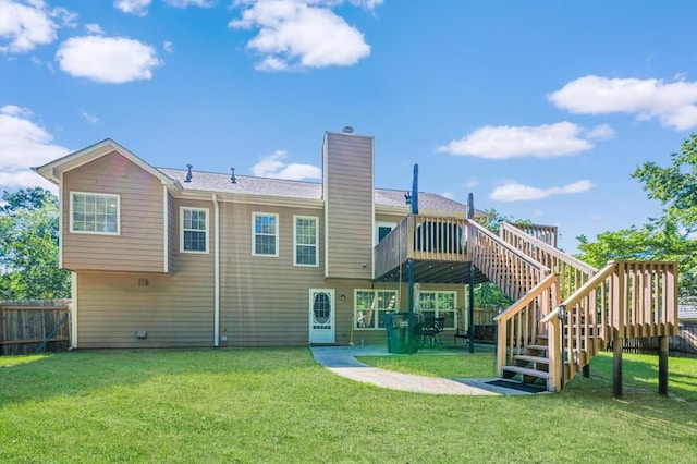 435 Flowering Trl, Grayson, GA 30017 - rear view of house featuring a wooden deck, stairs, a chimney, and a patio