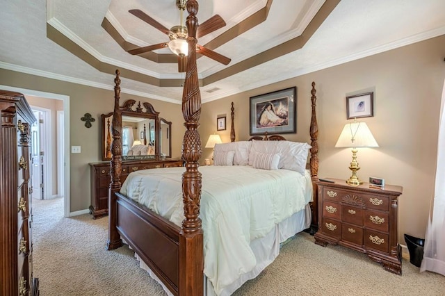 435 Flowering Trl, Grayson, GA 30017 - bedroom featuring a tray ceiling, light carpet, ornamental molding, a ceiling fan, and baseboards