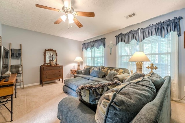435 Flowering Trl, Grayson, GA 30017 - living room featuring light colored carpet, a ceiling fan, a textured ceiling, and baseboards