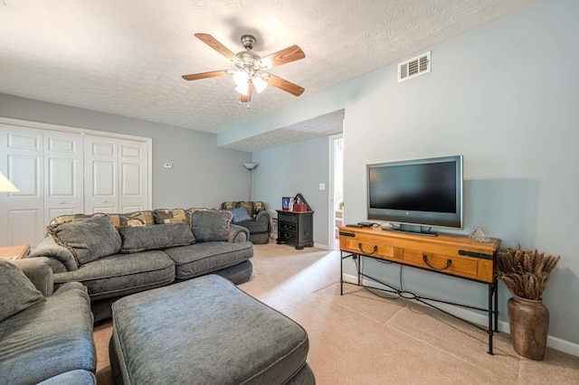 435 Flowering Trl, Grayson, GA 30017 - living area featuring carpet floors, a ceiling fan, a textured ceiling, and baseboards