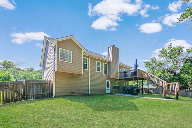 435 Flowering Trl, Grayson, GA 30017 - rear view of property featuring a chimney, stairs, a deck, and a patio