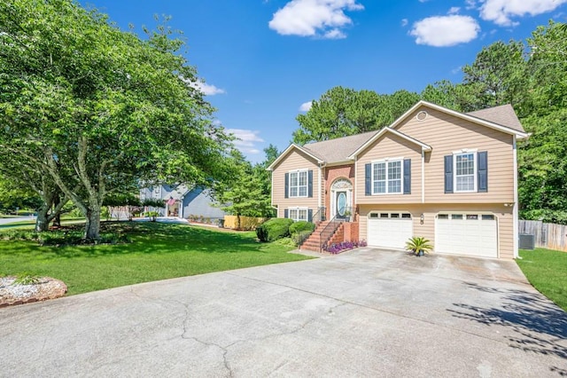 435 Flowering Trl, Grayson, GA 30017 - raised ranch with driveway, an attached garage, and central air condition unit