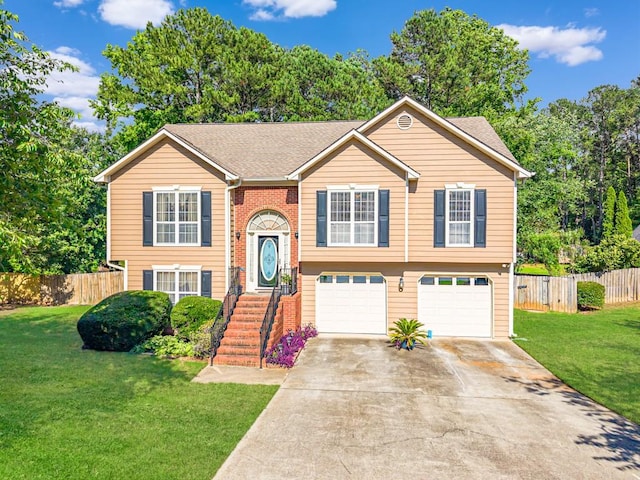 435 Flowering Trl, Grayson, GA 30017 - bi-level home featuring a garage, concrete driveway, and roof with shingles