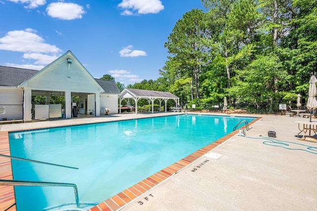 435 Flowering Trl, Grayson, GA 30017 - community pool featuring a gazebo, a patio area, and view of wooded area