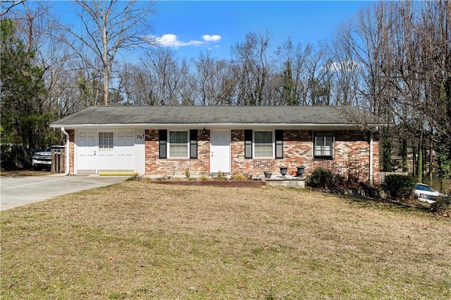 ranch-style home with concrete driveway, brick siding, and a front lawn