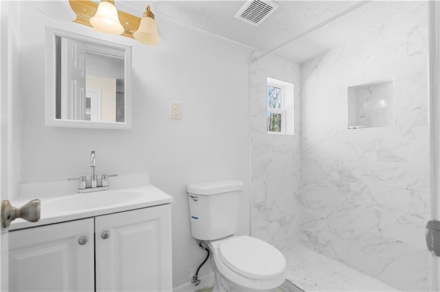 full bathroom with toilet, visible vents, a shower, and vanity