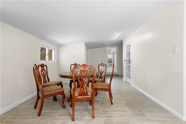 dining room featuring baseboards