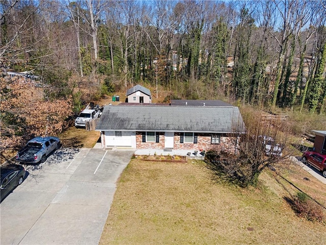 birds eye view of property with a wooded view