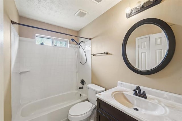 full bathroom featuring vanity, shower / bathing tub combination, a textured ceiling, and toilet