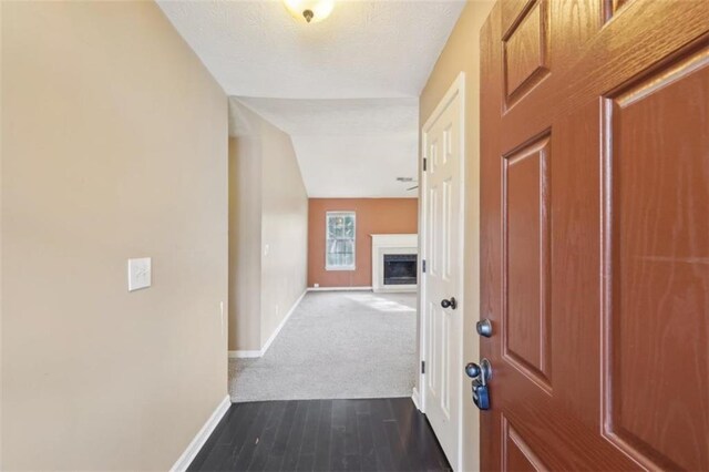 hall with dark wood-type flooring