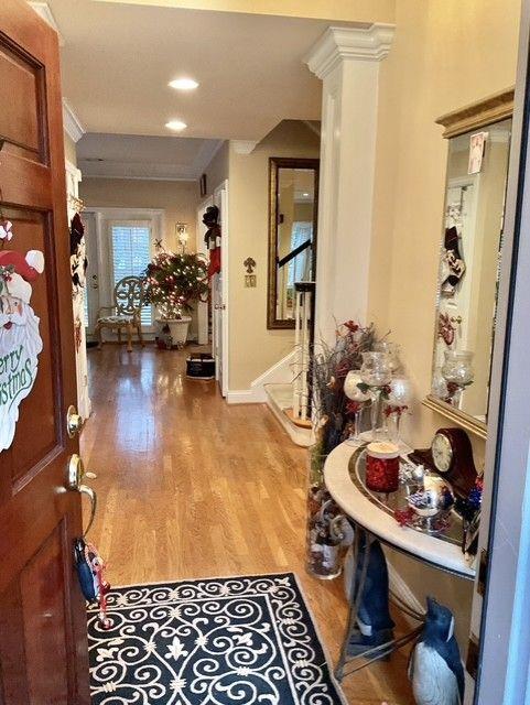 corridor with light hardwood / wood-style flooring