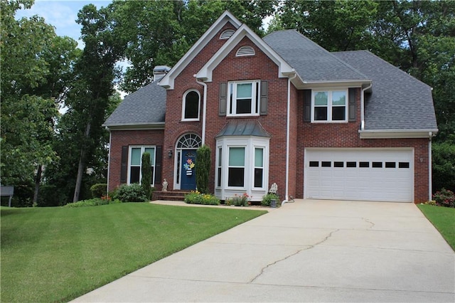 view of front of home with concrete driveway, a front lawn, a shingled roof, brick siding, and an attached garage
