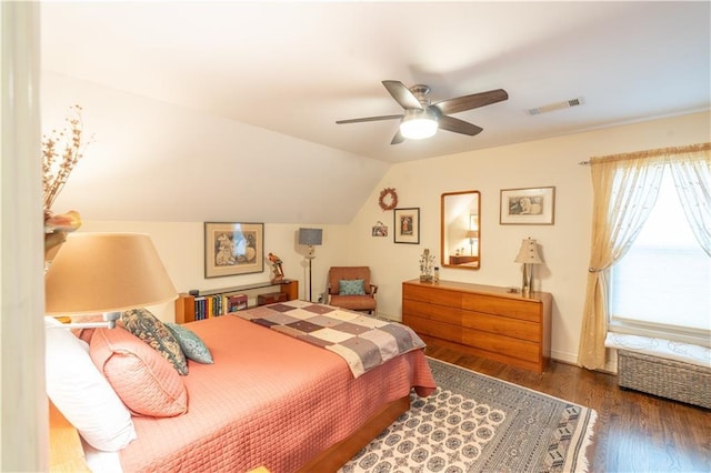 bedroom with lofted ceiling, wood finished floors, a ceiling fan, and baseboards
