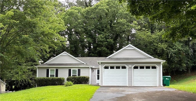225 Magnolia Tree Ct, Johns Creek, GA 30022 - ranch-style house with a front lawn, driveway, an attached garage, and view of scattered trees