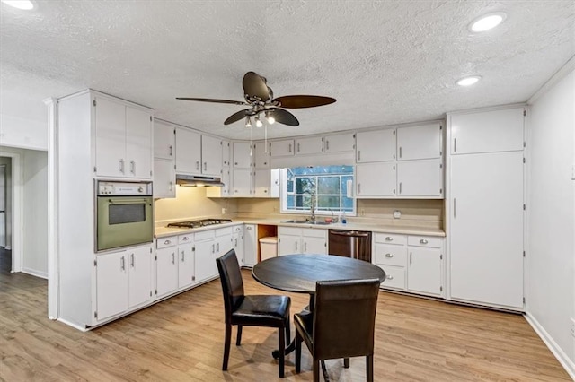 kitchen with sink, stainless steel appliances, light hardwood / wood-style floors, and white cabinets