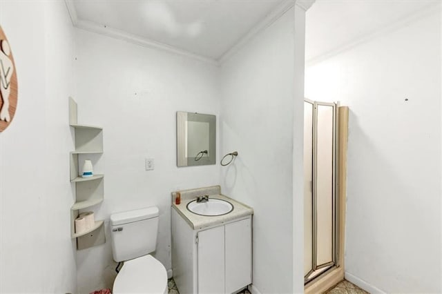 bathroom with vanity, crown molding, and toilet