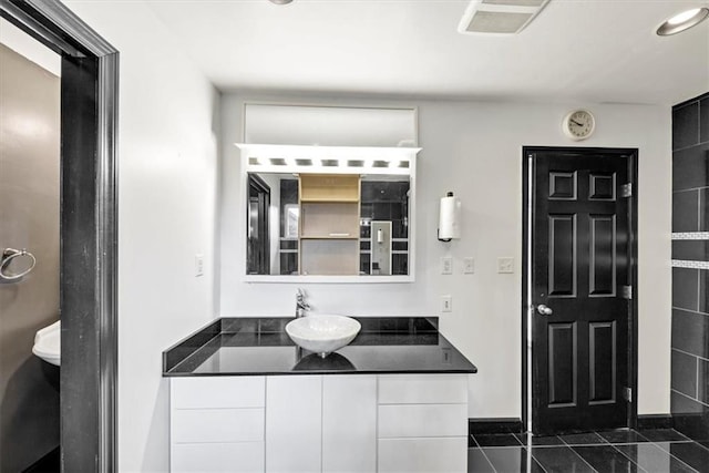 bathroom featuring vanity and tile patterned flooring