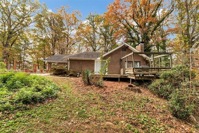 view of property exterior with a deck