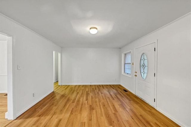 foyer with light hardwood / wood-style floors