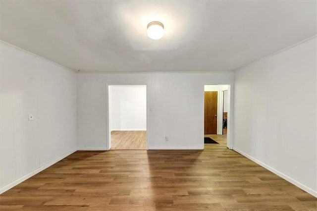 spare room featuring hardwood / wood-style floors