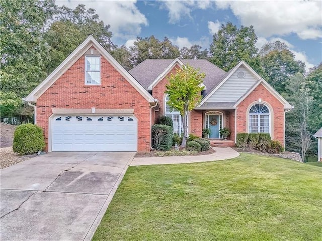 view of front property with a front yard and a garage