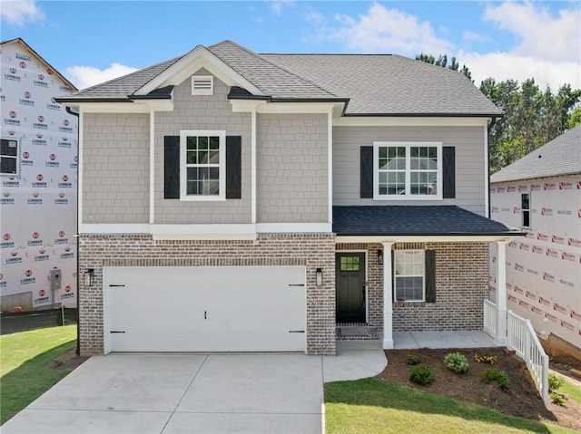 419 Crestmont Ln, Canton, GA 30114 - view of front of house featuring an attached garage, brick siding, concrete driveway, and a porch
