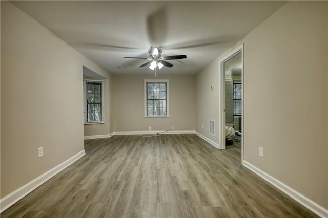 unfurnished room featuring ceiling fan and light wood-type flooring