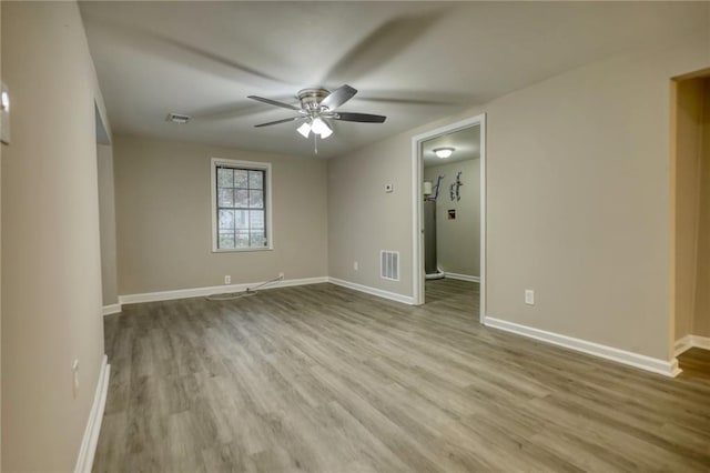 spare room with ceiling fan and light hardwood / wood-style flooring