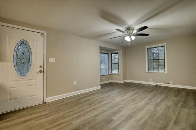 entrance foyer with ceiling fan and hardwood / wood-style flooring