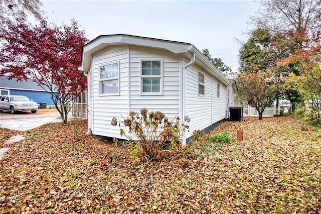 view of side of home featuring central air condition unit