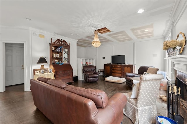 living area with crown molding, recessed lighting, a fireplace, and wood finished floors