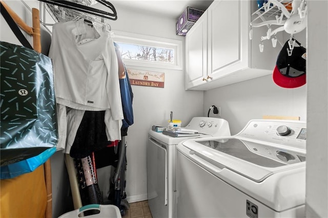 washroom with washer and clothes dryer and cabinet space