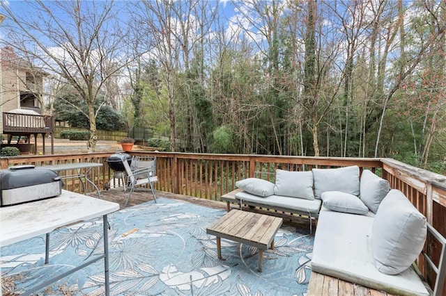 wooden terrace featuring an outdoor living space