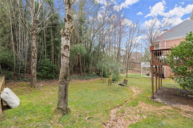 view of yard with a wooden deck