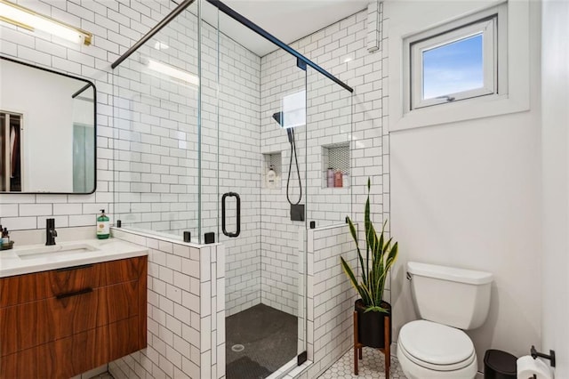 full bath with toilet, vanity, decorative backsplash, a stall shower, and tile walls