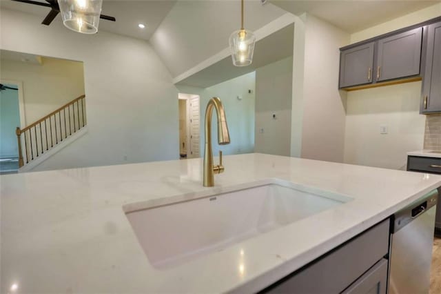 460 Ridge Point Dr, Monticello, GA 31064 - kitchen featuring a sink, a ceiling fan, lofted ceiling, dishwasher, and pendant lighting
