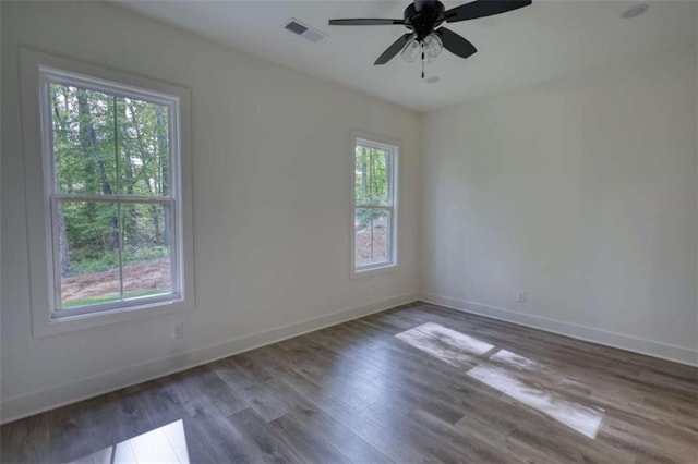 460 Ridge Point Dr, Monticello, GA 31064 - unfurnished room with wood finished floors, baseboards, and a ceiling fan