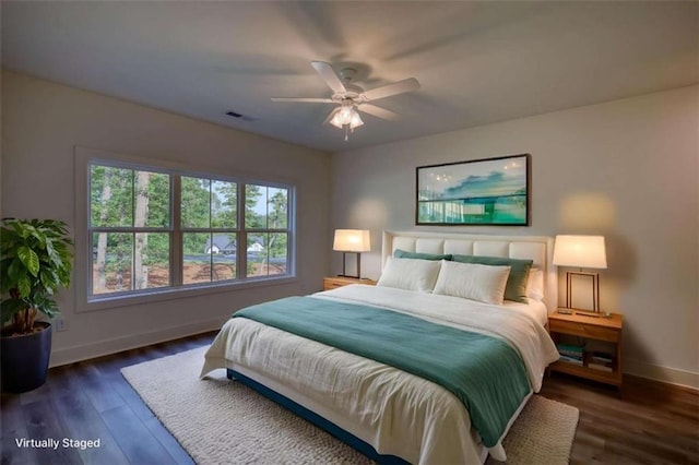 460 Ridge Point Dr, Monticello, GA 31064 - bedroom with baseboards, wood finished floors, and a ceiling fan