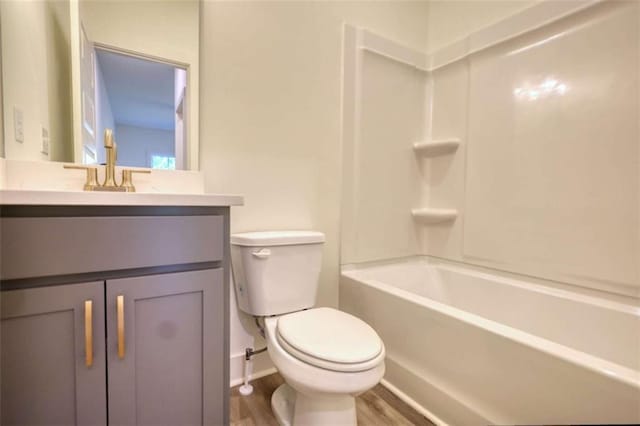 460 Ridge Point Dr, Monticello, GA 31064 - full bathroom with vanity, toilet, wood finished floors, baseboards, and bathtub / shower combination
