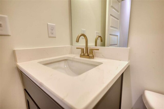460 Ridge Point Dr, Monticello, GA 31064 - half bathroom featuring vanity and toilet