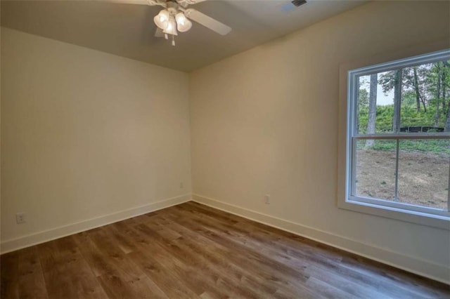 460 Ridge Point Dr, Monticello, GA 31064 - unfurnished room with baseboards, wood finished floors, and a ceiling fan